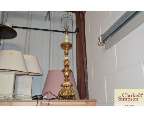 A gilt Rococo style table lamp and shade 