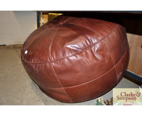 A large leather pouffe