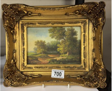 A gilt framed over painted print of a woodland scene
