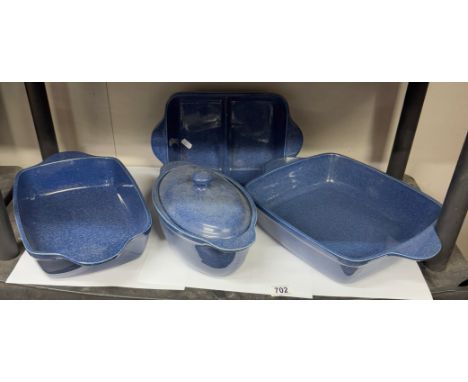 A quantity of  heavy blue glazed cookware including roasting pans
