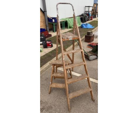 Two wooden step ladders