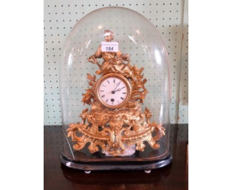 A 19th century-style gilt metal mantle clock under a glass dome, the enamel dial bearing Roman numerals (40cm) to include dom