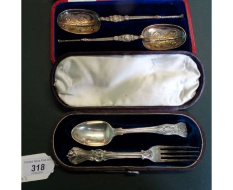 Two cased sets of silver flatware, to include a mixed spoon and fork set and a pair of decorative spoons, various dates and m