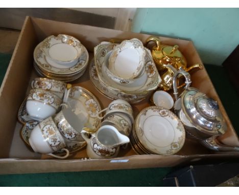 A Noritake part-tea service, numbered 44318, a six place setting, comprising: tea cups, saucers, side plates, milk jug, cake 