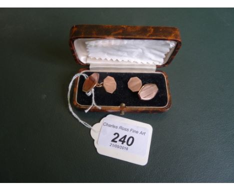 A pair of 9ct gold cufflinks with engine turned decoration.