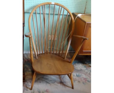 Three large ercol hoop back low seated armchairs (71cm wide).