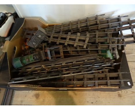 A mid-20th century child's clockwork railway engine, together with a quantity of track and other related items.