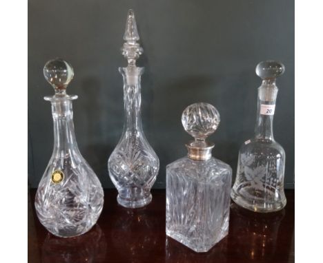 An 'Elizabeth' hand cut lead crystal decanter and stopper, together with three other decanters.