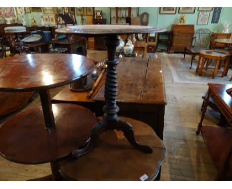 A late Victorian circular occasional table, having central walnut panel flanked by stepped relief decoration over spiral twis