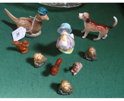 A Beswick Beatrix Potter Jemima Puddleduck figurine, together with a Beswick Beneagles miniature Scotch Whisky decanter model