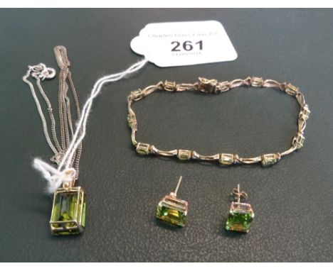 A peridot and 9ct gold bracelet and matching earrings, together with a 9ct gold chain.