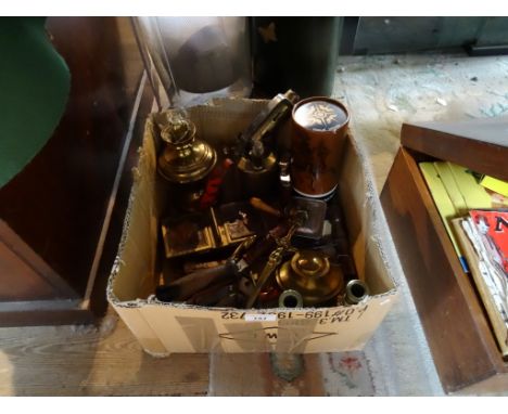 A collection of assorted brassware, to include: an oil lamp, paraffin lamp, flatiron, candlestick, inkwell, double sided ciga
