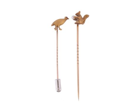  Two early 20th century stick pins,   the first in the form of a seated squirrel, with textured fur and holding a pearl, 10mm