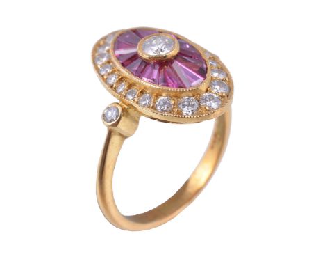  A French ruby and diamond dress ring,   the navette shaped panel centrally set with a brilliant cut diamond, within a surrou