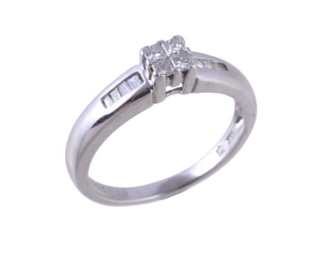  A diamond ring,   the central panel set with four princess cut diamonds, to baguette cut diamond accented shoulders, approxi