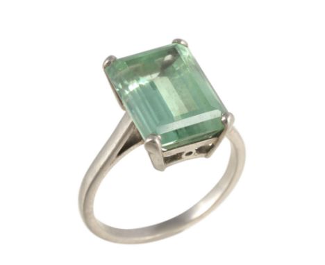  A green tourmaline dress ring,   the step cut green tourmaline with canted corners, in a four claw setting, finger size Q 