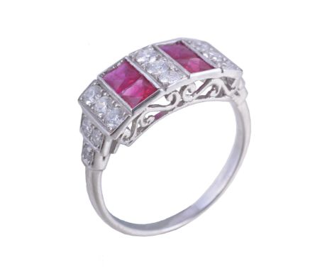 A ruby and diamond panel ring  , the two rows of French cut rubies interspaced with three rows of brilliant cut diamonds, ap