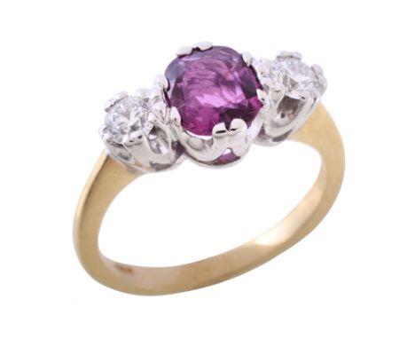  A ruby and diamond three stone diamond ring  , the oval cut ruby flanked by two brilliant cut diamonds, approximately 0.40 c