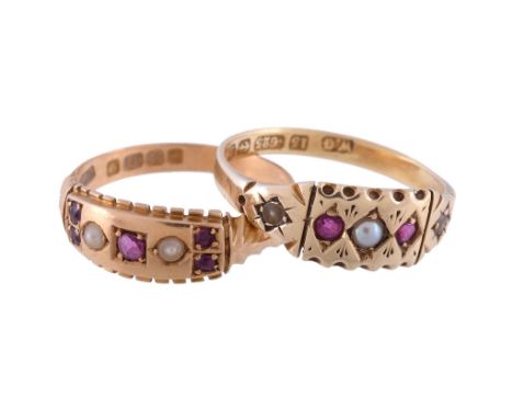  An Edwardian 18 carat gold ruby and pearl ring,   the panel set with circular cut rubies, and two half seed pearls, within a