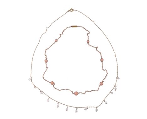 Ω A late Victorian coral necklace, circa 1900, the graduated circular cabochon coral in spectacle settings with belcher link 