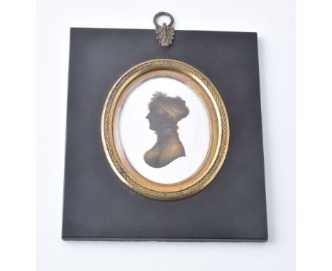 John Field (1772-1848)   Portrait of a young lady   Silhouette on plaster with bronzing   8cm x 6cm, oval   In a rectangular 