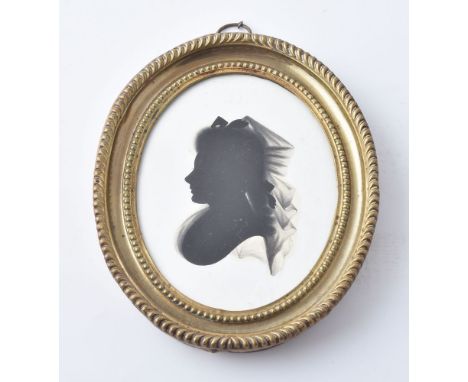 John Miers (British, circa 1758-1821) Portrait of a lady   Silhouette painted on plaster 9cm (3 1/2in) high, oval In pressed 