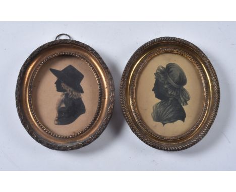 John Butterworth (before 1761-1818/21)   Portrait of a lady   Silhouette painted on card   9cm (3 1/2in) high, oval   In a ha