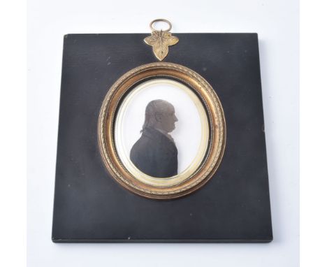 Arthur Lea (1768-1828)   Portrait of a gentleman Silhouette painted on curved glass with verre églomisé border   9.3cm x 7.5c