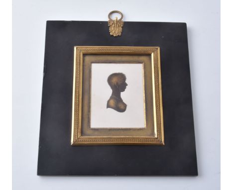 John Field (1772-1848)   Portrait of a young lady   Silhouette on plaster with bronzing   8.2cm x 6.3cm   In a rectangular pa