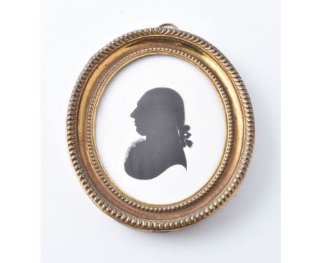 John Miers (British, circa 1758-1821) Portrait of a gentleman   Silhouette painted on plaster 9cm (3 1/2in) high, oval In pre