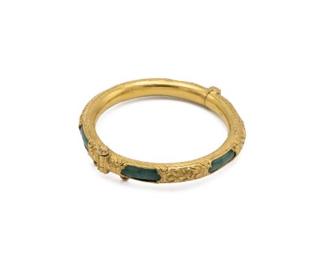 Jade Chinese bangle decorated in 14ct gold panels to the outer ring depicting leaves, hallmarked to the inner ring, total wei