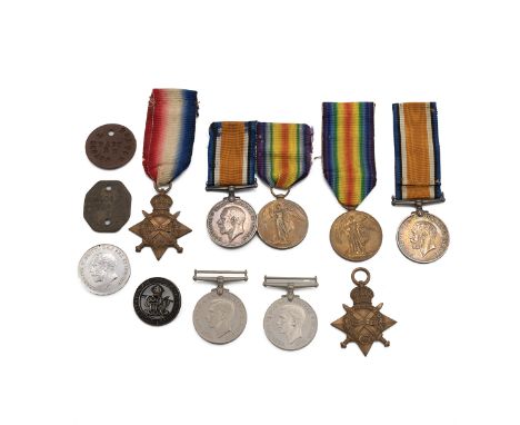 Three WWI medals awarded to SJT J SMITH, R.G.A, 6915, along with a pair awarded to PTE G H SMITH, GLOUCESTER REG, 25512, alon