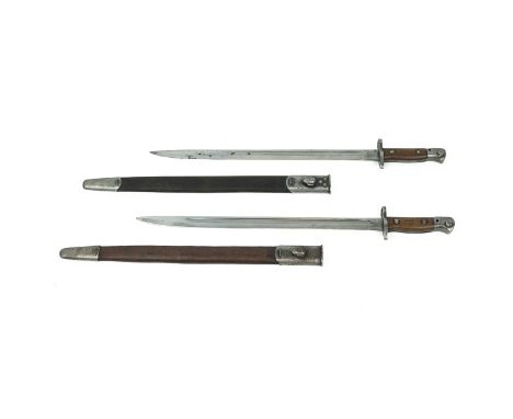 Two English sword bayonets designed to be used with short magazine Enfield rifle, with scabbard, one stamped with crown and d