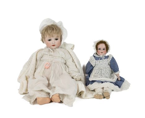 Two German vintage dolls: one Melitta German doll marked 12 to the back of the head, with lashed blue eyes, in original layer