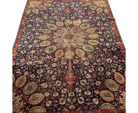 Vintage blue ground Persian Tabriz carpet, having Shah Safi designs. 330 x 232cm approx.(B.P. 21% + VAT) 