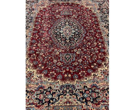 Large rich red ground Persian Kashmar floral and foliate carpet. 305 x 400cm approx.(B.P. 21% + VAT) 