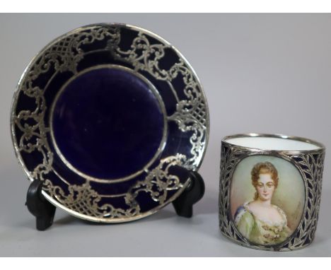 Early 20th century Austrian Vienna porcelain coffee can and saucer, on a blue ground with white metal overlay and having hand