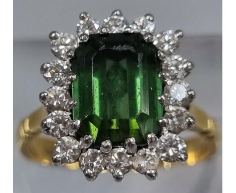 18ct gold diamond seventeen stone ring inset with central faceted green stone. 4.8g approx. Ring size K.(B.P. 21% + VAT) 