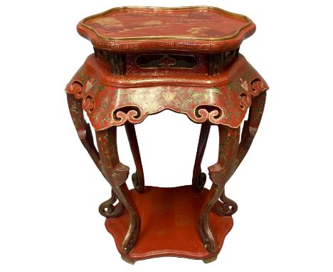 Large Chinese design red lacquered fishtank or jardiniere stand, having serpentine shaped top painted with scenic designs ove