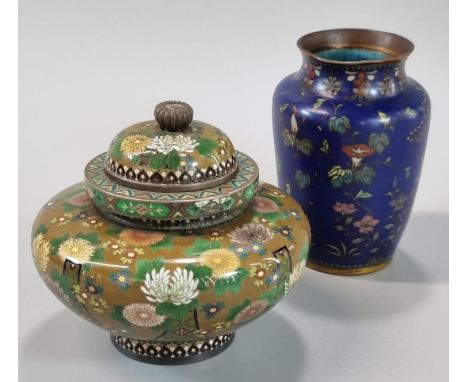 Good quality Japanese cloisonne jar and cover of compressed baluster form, overall with multi-coloured flowers and foliage in