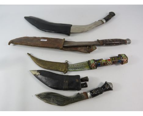 Four vintage tourist Kukri style knives.