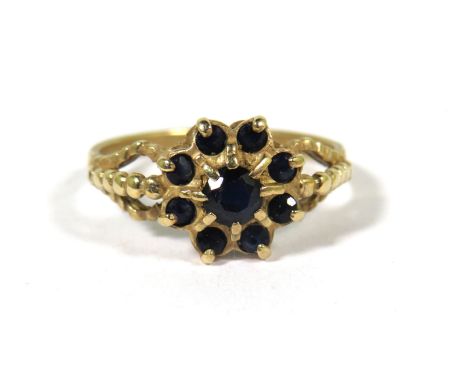 9ct Yellow Gold Ring set with Sapphires in a Flower pattern.  Finger size 'L-5'   1.8g