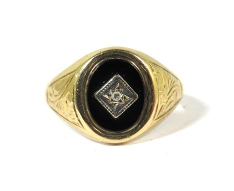 9ct Yellow Gold Signet Ring set with a central Oval Onyx with Diamond to centre.  Finger size  N  3.1g