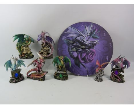 Anne Stokes collection dragon clock and various dragon figurines some which light up.