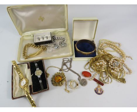 Mixed lot of costume jewellery including a vintage Tudor ladies wristwatch and a 9ct gold plated bangle etc.