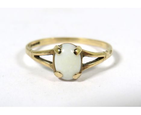 9ct Yellow Gold Ring set with a small white Opal which measures approx 7 x 5 mm.  Finger size 'M'   1.1g