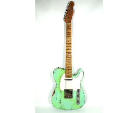 Copy of a 1960's era Fender Telecaster in aged Surf Green, with lots of superficial&nbsp; wear, some wear to fretboard. Sound