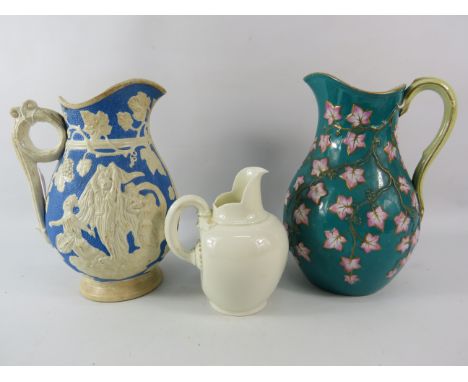 Three Victorian Jugs one by Royal Worcester, the tallest measures 9" tall.