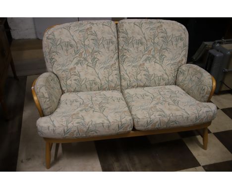 Two seat Ercol Blondewood Settee in the Jubilee style in excellent condition.  Measures approx H:33 x W:55 x D: 34 inches. Se