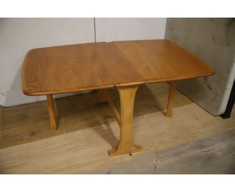 Small Ercol Dropleaf space saver table . Model 820 gate leg table. Very good condition in Blondewood. H:18 x W:40 (extended) 
